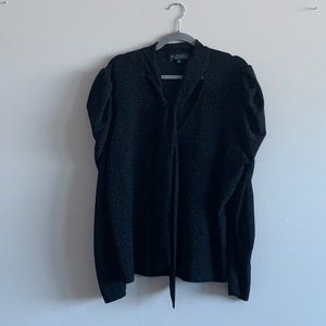 Puffy sleeve shirt with sophisticated tie detail.